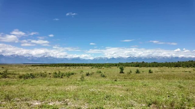 View from the side window of the car to the Tunka mountains. Auto tour of the Tunka Valley, Buryatia