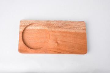 Close-up photo of Wooden drink coaster isolated on white background. High angle, Flat Lay Setup.