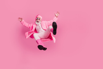 Full body portrait of impressed grandfather jump fall empty space wear new year boots bathrobe isolated on pink color background