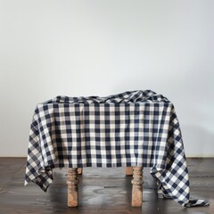 A checkered tablecloth is draped over a wooden table