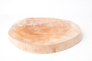 Close-up photo of Wooden cutting board made from cutted whole tree trunk isolated on white background. Shot on 30 degree angle setup.