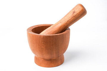 Close-up photo of Wooden mortar and pestle isolated on white background. Shot on 30 Degree angle setup.