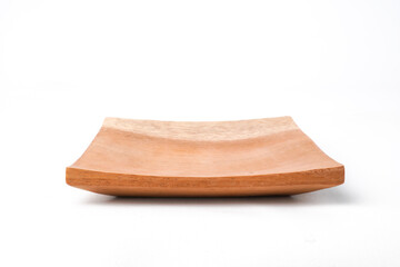 Close-up photo of Wooden sushi plate or tray isolated on white background. Shot on eye-level angle setup.