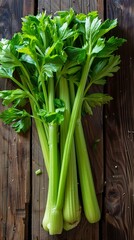 Fresh Green Celery Stalks on Rustic Wooden Background