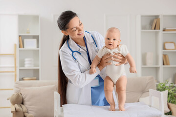 Fototapeta premium Female pediatrician with little baby at home