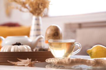 Cup of green tea on table in room. Closeup