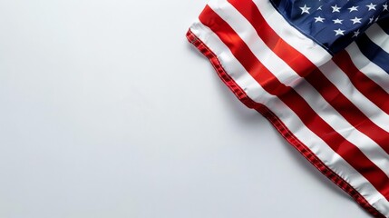 Obraz premium American flag draped on a white background with copy space.