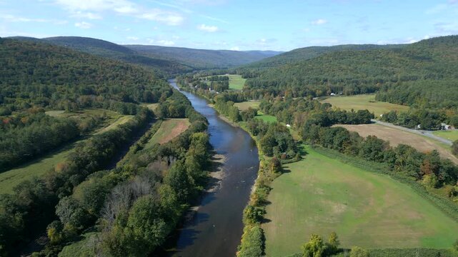 Aerial orbit pullback above Mohawk Trail by Deerfield River in Western Massachusetts New England USA