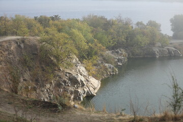 Obraz premium Foggy morning in autumn landscape with lake and mist