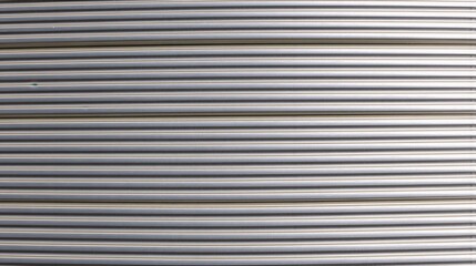 Obraz premium generative ai, Horizontal metallic ridges with a smooth, uniform surface, offering a modern and industrial aesthetic ideal for contemporary architecture