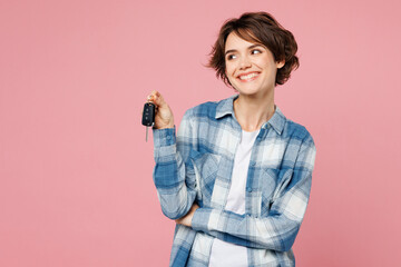 Young woman wear blue shirt white t-shirt casual clothes hold in hand car key fob keyless system...