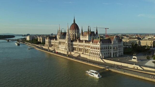 Aerial around view of Budapest city and Hungarian Parliament building on Danube river, Hungary, 4k