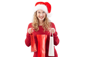 Smiling blonde young woman opening a Christmas present shopping bag while wearing a Santa hat, isolated on a white background. For sale and offer promotions, online shopping adv banner, or gift card