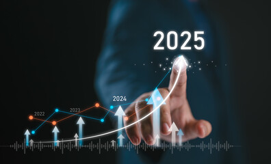 Businessman draws increase arrow graph corporate future growth year 2024 to 2025. Planning,...
