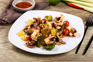 Roasted octopus with vegetables and oil