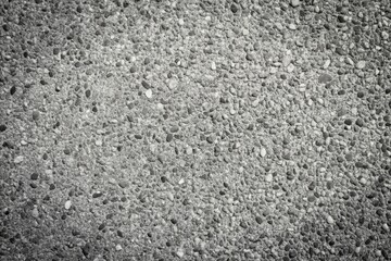 Fototapeta premium Minimalist exposed aggregate concrete texture in black and white