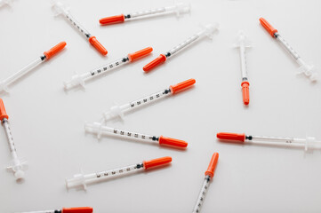 Healthcare, syringe and injection for vaccine, medication and illness or cure on white studio background. Drugs, needle and pharmaceutical product for pharmacy, flu shot or equipment at clinic