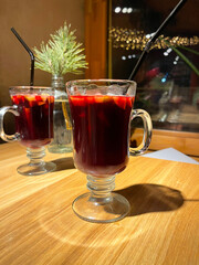 Two glasses of mulled wine in New Year's decorations