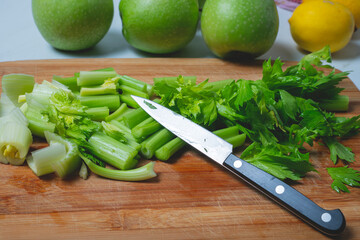 Fresh sliced celery stalks on a wooden board. detox concept and healthy food