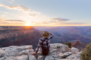 Young tourist woman at Grand Canyon. Grand Canyon National Park. Arizona, USA