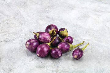 Small organic young purple round eggplant