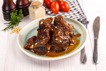 Prepared tasty beef ribs with sauce