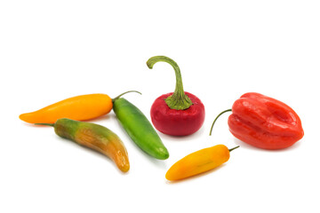 Assorted colorful fresh organic peppers isolated on a white background. Agricultural products and harvesting.	