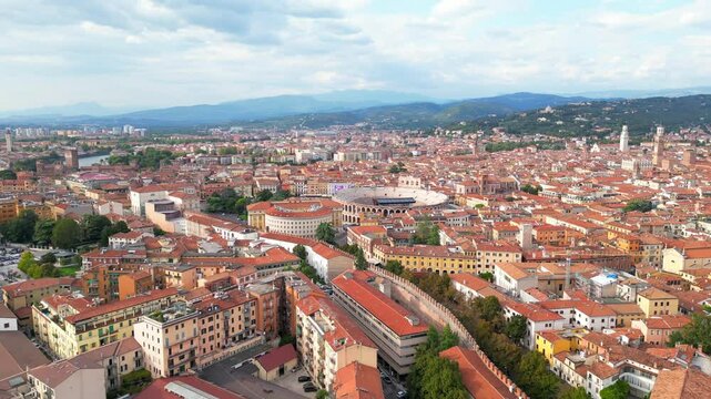 Aerial view of the city of Verona with its arena and mountain in the background in Veneto, Italy
