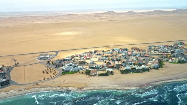 Aerial photography Langstrand is a small beach resort on the Atlantic coast in western Namibia. Langstrand and its neighboring sister resort Dolfynstrand lies between Walvis Bay and Swakopmund.