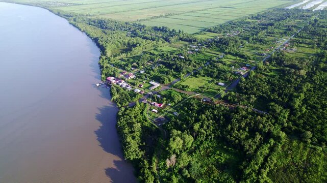 Fly over rural village by commewijne river, Johan and Margaretha and Rust and Werk plantation, Suriname