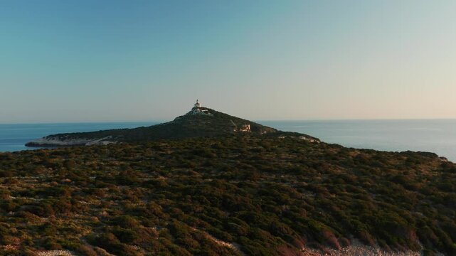 Forested Rocky Island Overlooking Lighthouse In Susac Islet Near Lastovo, Croatia. Aerial Drone Shot