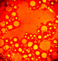 orange background with bubbles, oily water