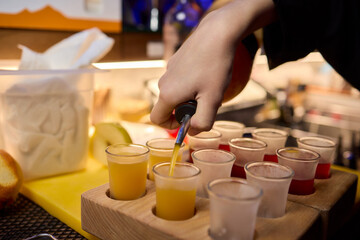 Vibrant and Colorful Shot Glasses Arranged on a Tray for a Fun and Lively Party Event