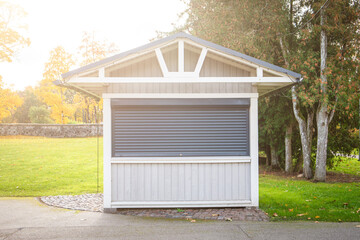 Locked tourist souvenir kiosk. Sunny autumn day