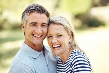 Fototapeta premium Happy, portrait and mature couple in nature at park for bonding, marriage and connection in morning. Outdoor, hug and man and woman from Australia embracing in garden for romance on date with love.