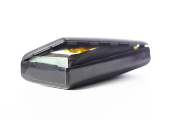 Bloated black power bank on a white background, isolate. Danger of power bank explosion, close-up