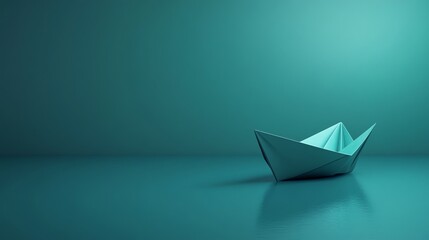 Fototapeta premium A simple paper boat sits on a teal surface with a teal background.