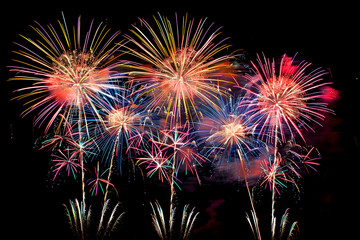 A photo of colorful fireworks lighting up the night sky, creating an enchanting 