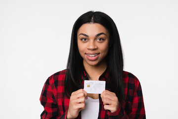 Young african american woman black girl female afro student in casual showing presenting using hold in hands mock up of credit bank card isolated on white background. Technology banking concept