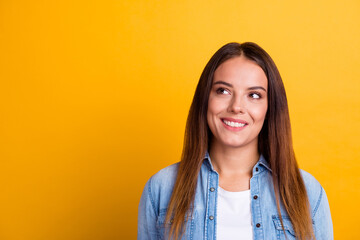 Photo of adorable positive lady look empty space hands cheeks wear white shirt isolated yellow color background