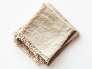 Elegant linen fabric neatly folded showcasing its texture and natural hue in soft ambient light