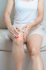 Arthritis and Muscle Pain Relief Cream concept. woman having knee ache and muscle pain due to Runners Knee or Patellofemoral Pain Syndrome, osteoarthritis, rheumatism and Patellar Tendinitis