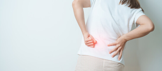woman having back body ache during at home. adult female with muscle pain due to Piriformis Syndrome, Low Back Pain and Spinal Compression. Office syndrome and medical concept