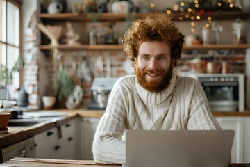 A man sitting in front of a laptop computer