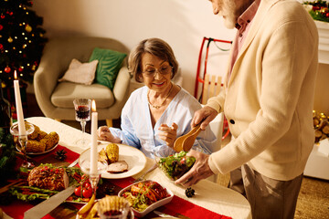A loving senior couple shares a delightful Christmas meal together, filled with warmth and joy.