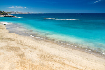 A golden sandy beach day at Playa del Duque, Tenerife