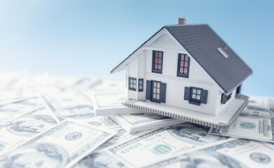 Home real estate on money concept for mortgage, buying, savings or house for sale background