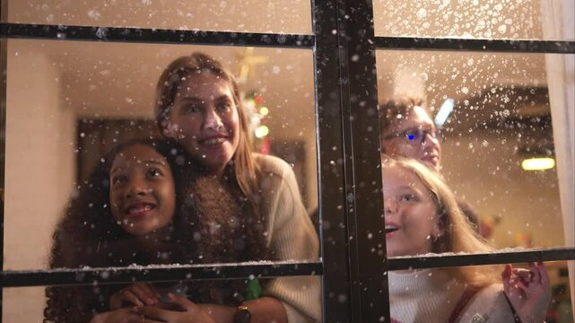 Parents and a teen girl on Christmas night with the first snowfall