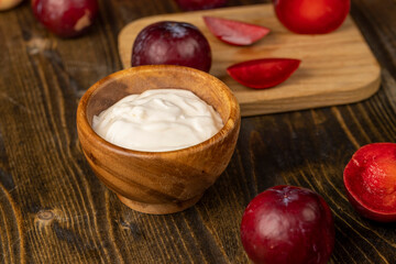 yogurt made from milk and red ripe plum