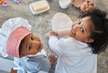 Children, portrait and baking in home with rolling pin, family bonding and together for food prep. Kids, high angle and siblings for learning to cook in kitchen, dough and ingredients for pastry